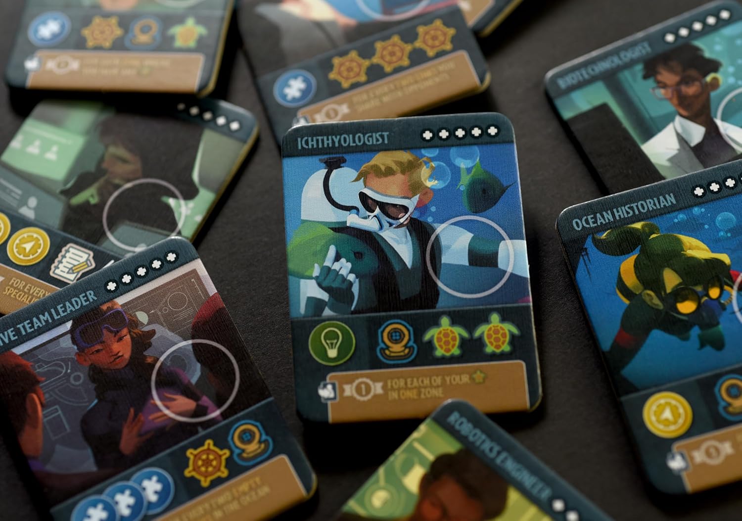 Collection of character cards with various illustrations on a dark surface