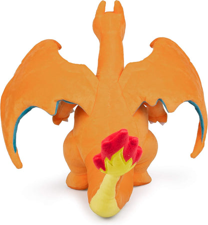 Plush toy Pokemon Charizard with red flaming tail on a white background