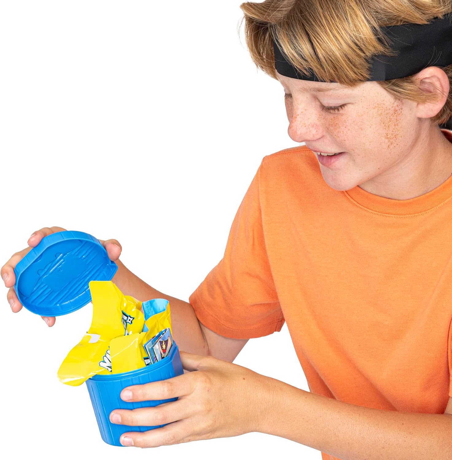 Child holding a blue container with yellow items on a white background
