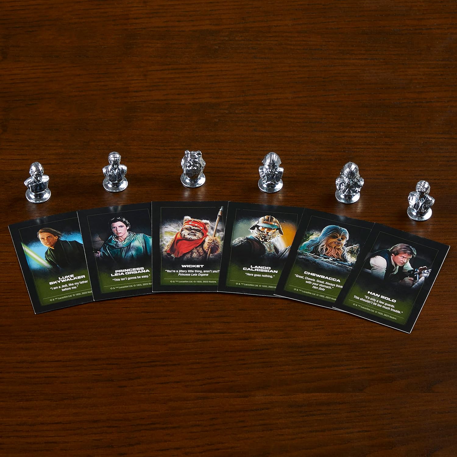Set of miniatures and star wars character cards on a wooden surface