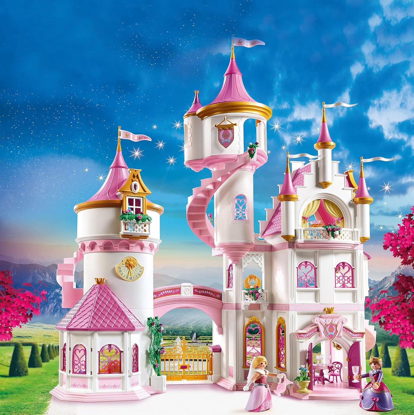 Pink toy castle with towers against a blue sky with stars