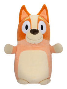 Plush toy of a cartoon fox Bingo with a white belly on a white background