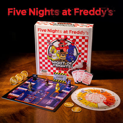 Five Nights at Freddy's board game set with components on a wooden surface