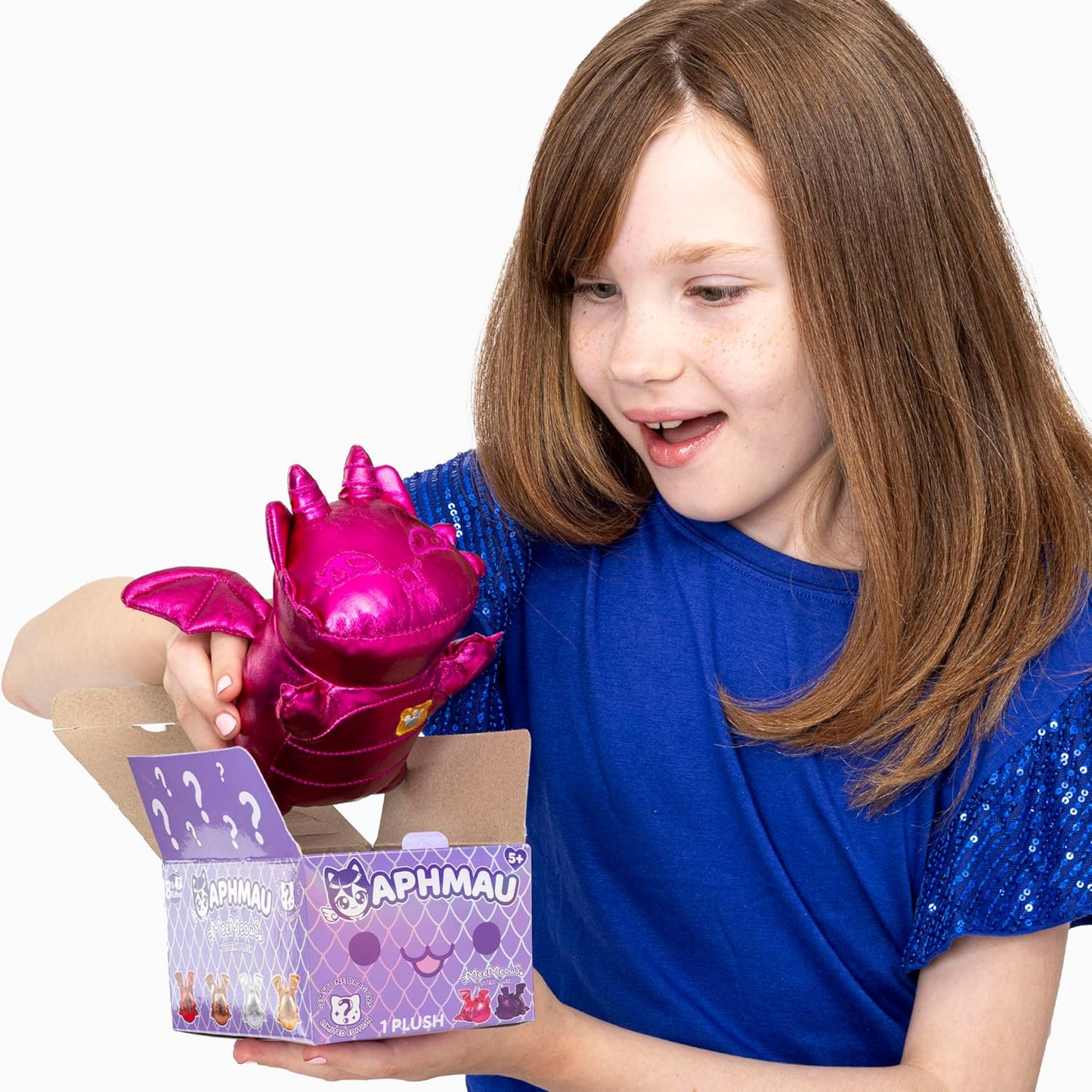 Child holding a pink toy with a purple box labeled 'Aphmau' on a white background
