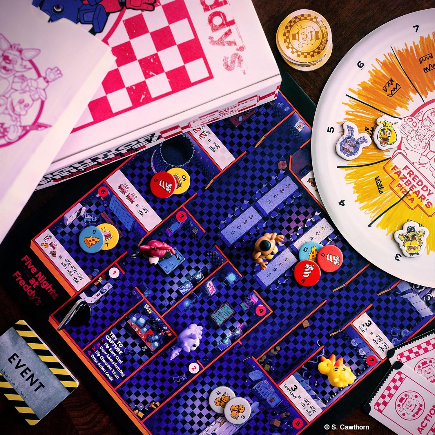 Board game with colorful pieces and a clock on a wooden surface