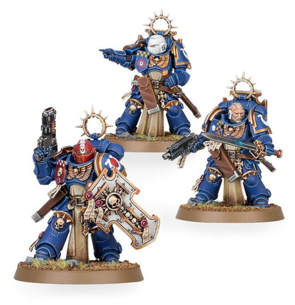 Three detailed figurines in blue and gold armor on a white background