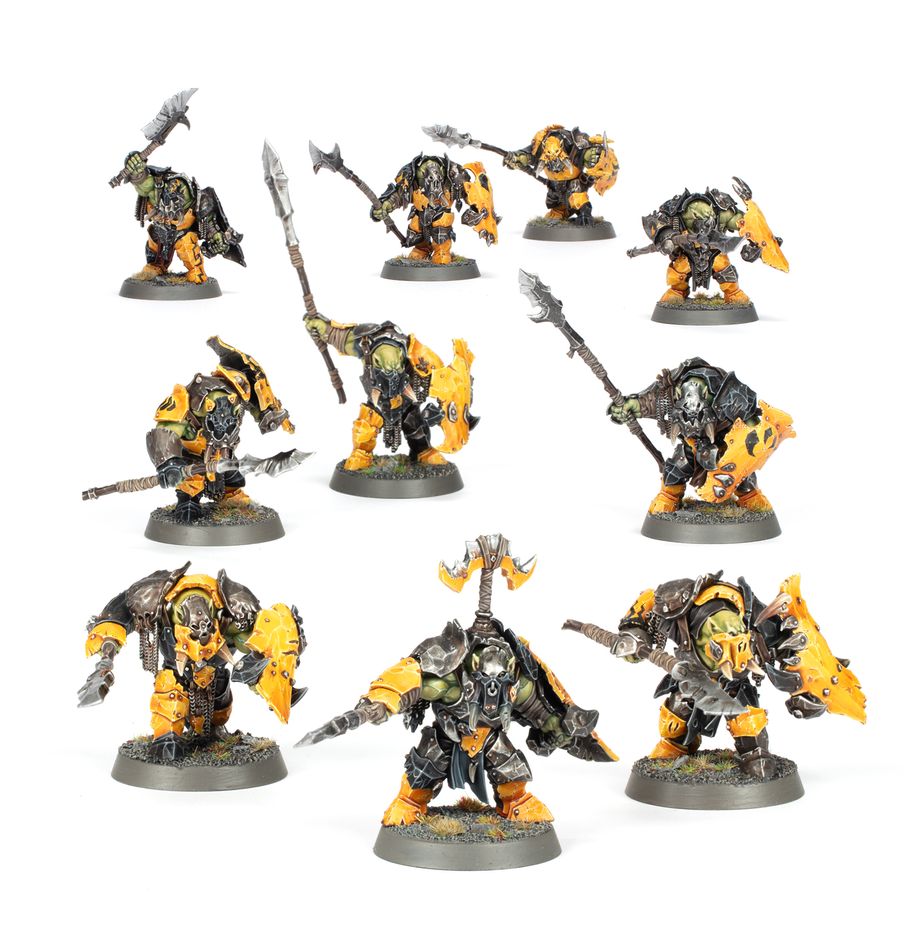 Set of miniature figurines with yellow and black armor on a white background