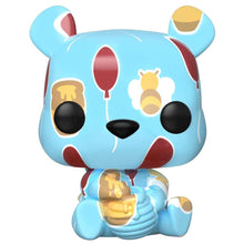 Colorful cartoon bear figurine with ice cream on a white background