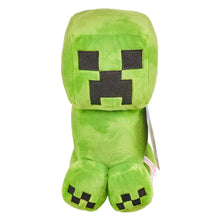 Green mincraft plush toy with pixelated face on a white background