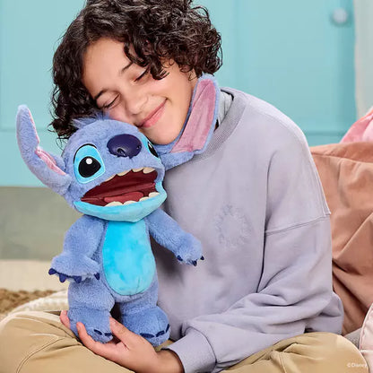 Person holding a plush toy resembling a character from an animated movie, sitting on a couch.