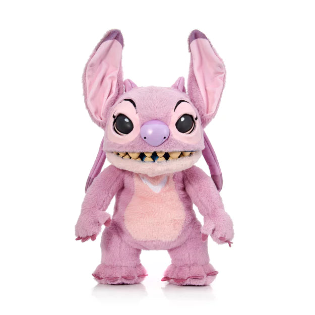 Pink plush toy with large ears on a white background