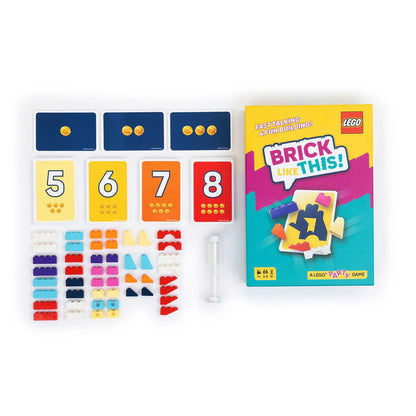 LEGO party game set with colorful bricks and number cards on a white background