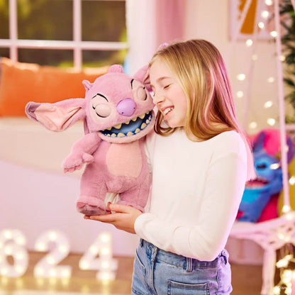 Young girl holding a pink plush toy with a smiling expression in a festive indoor setting.