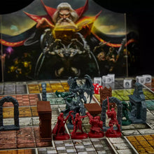 Board game setup with miniature figures and a fantasy-themed box in the background
