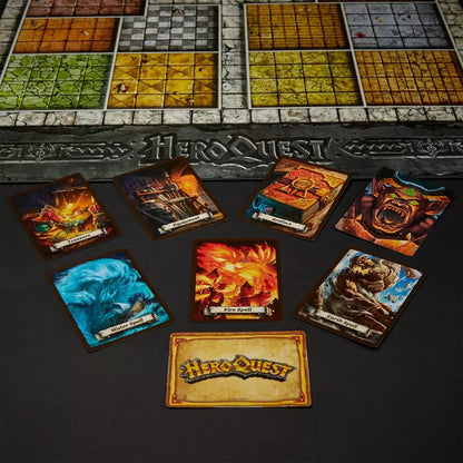 HeroQuest game components including cards and board on a dark surface