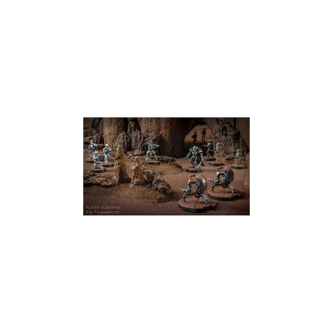 Miniature figures in a fantasy setting with rocky terrain