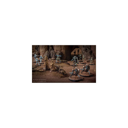 Miniature figures in a fantasy setting with rocky terrain