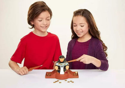 Two children playing with a toy Niffler  on a white background