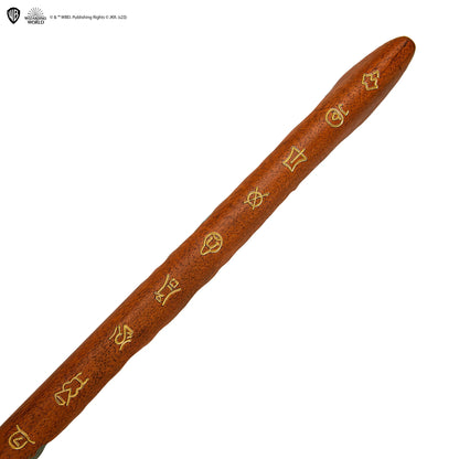 Wooden staff with engraved symbols on a white background