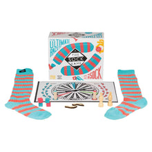 Board game set with striped socks and game board on a white background