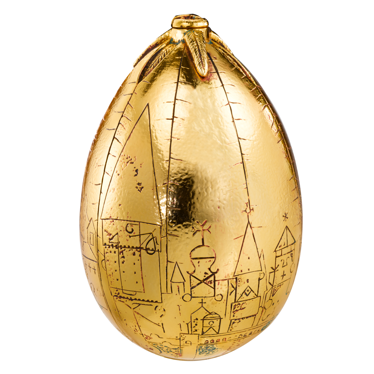 Gold egg-shaped chocolate with engravings on a white background