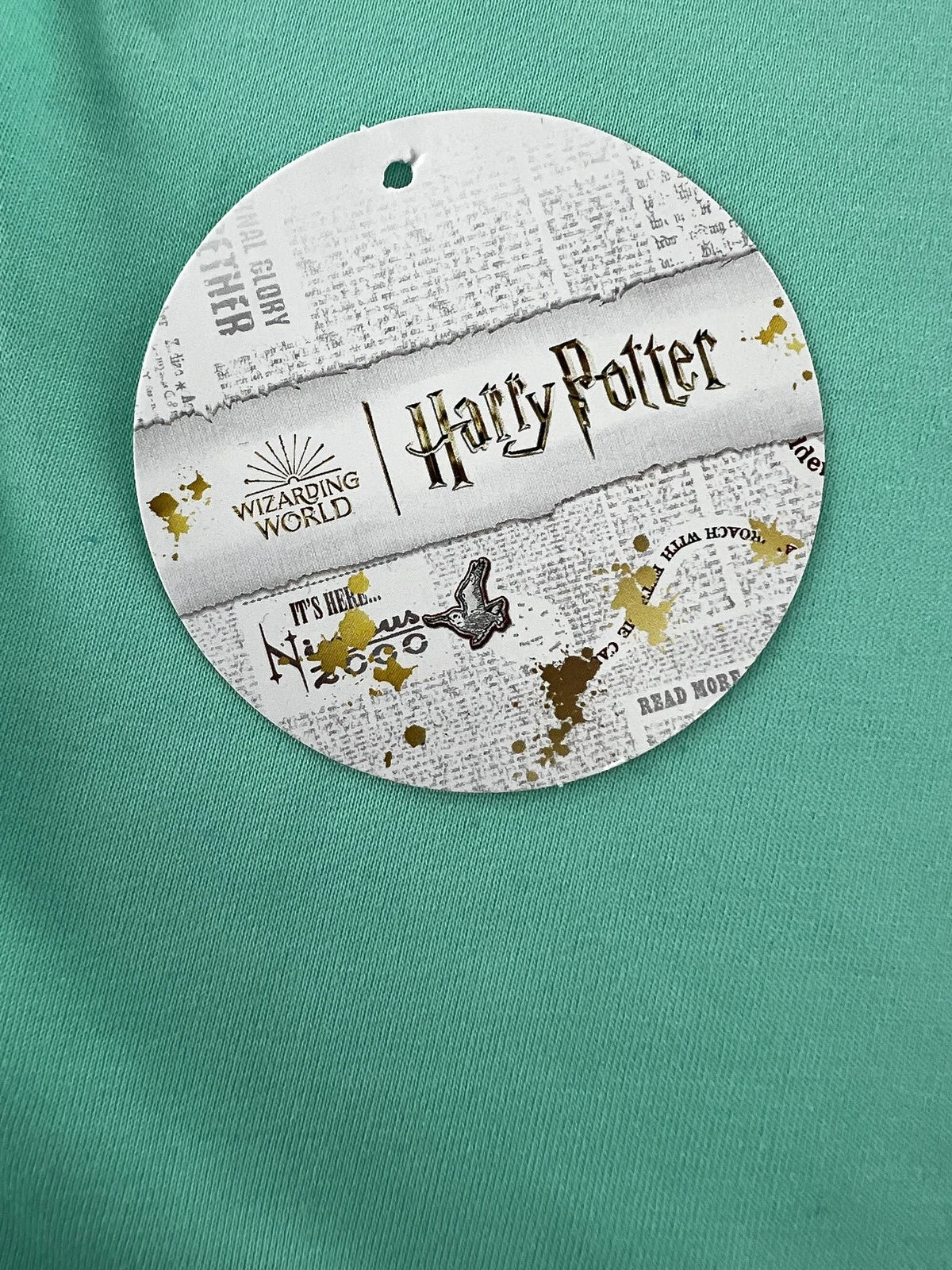Round Harry Potter-themed product on a green background