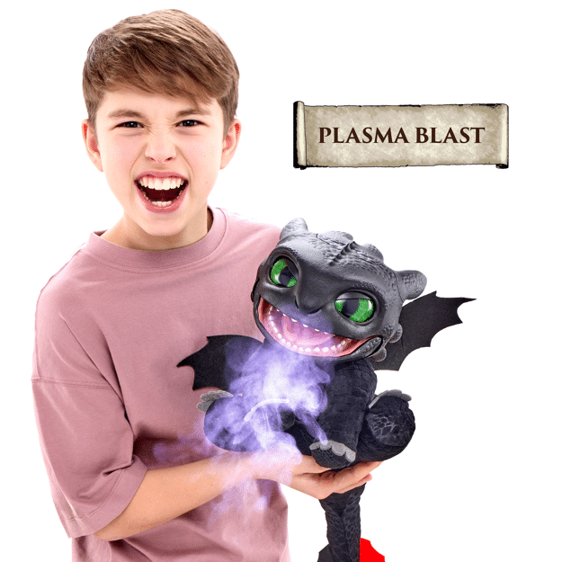 Child holding a plush dragon toy with 'Plasma Blast' feature on a white background