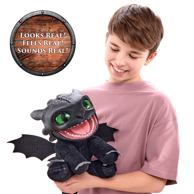 Child holding a plush dragon toy with text 'Looks Real! Feels Real! Sounds Real!'
