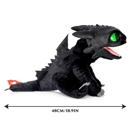 Plush dragon toy with green eyes and red mouth, showing size measurement on a white background