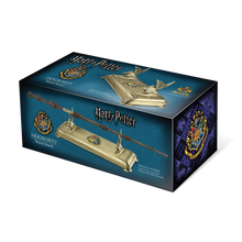 Box for Harry Potter Hogwarts Wand Stand with gold wand and decorative elements on a blue background