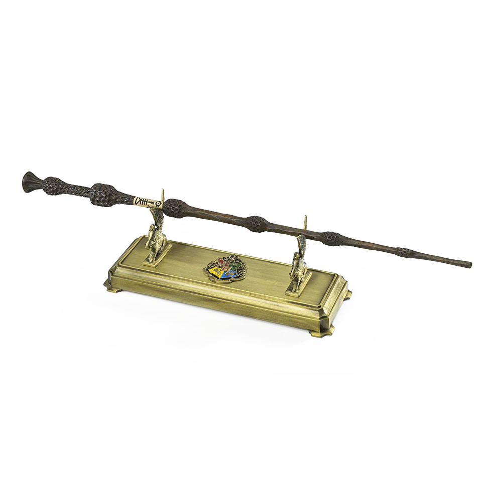 Harry Potter wand on a gold stand with a crest emblem on a white background