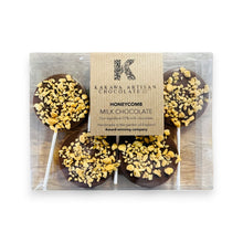 Packaged chocolate honeycomb lollipops with Kakawa Artisan Chocolate branding.