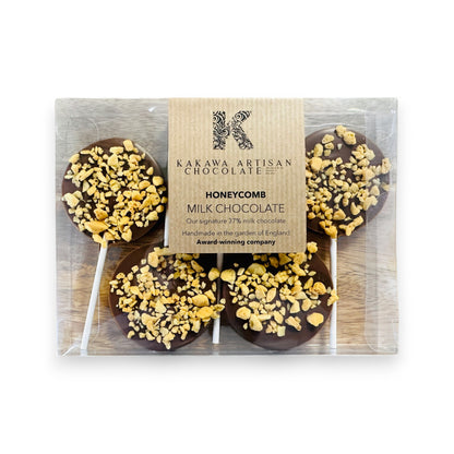 Packaged chocolate honeycomb lollipops with Kakawa Artisan Chocolate branding.