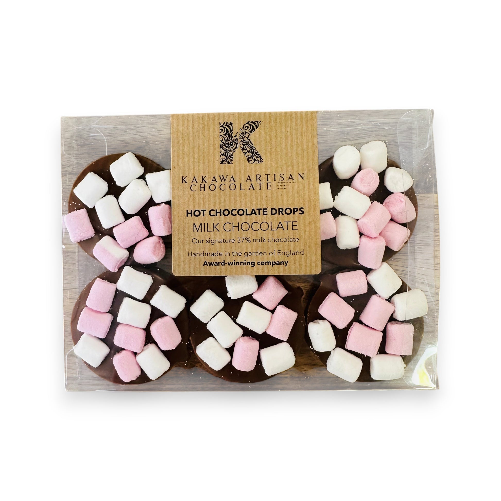 Pack of Kakawa Artisan Chocolate milk chocolate drops with pink and white marshmallows on a white background