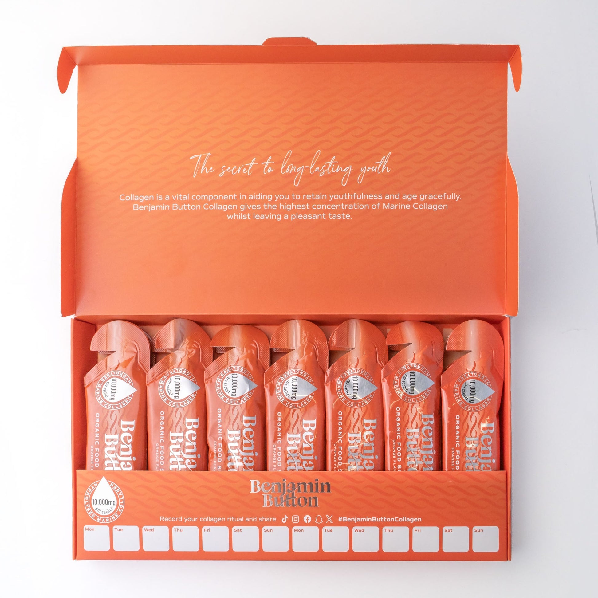 Orange packaging of Benjamin Button Collagen with multiple bottles inside on a white background
