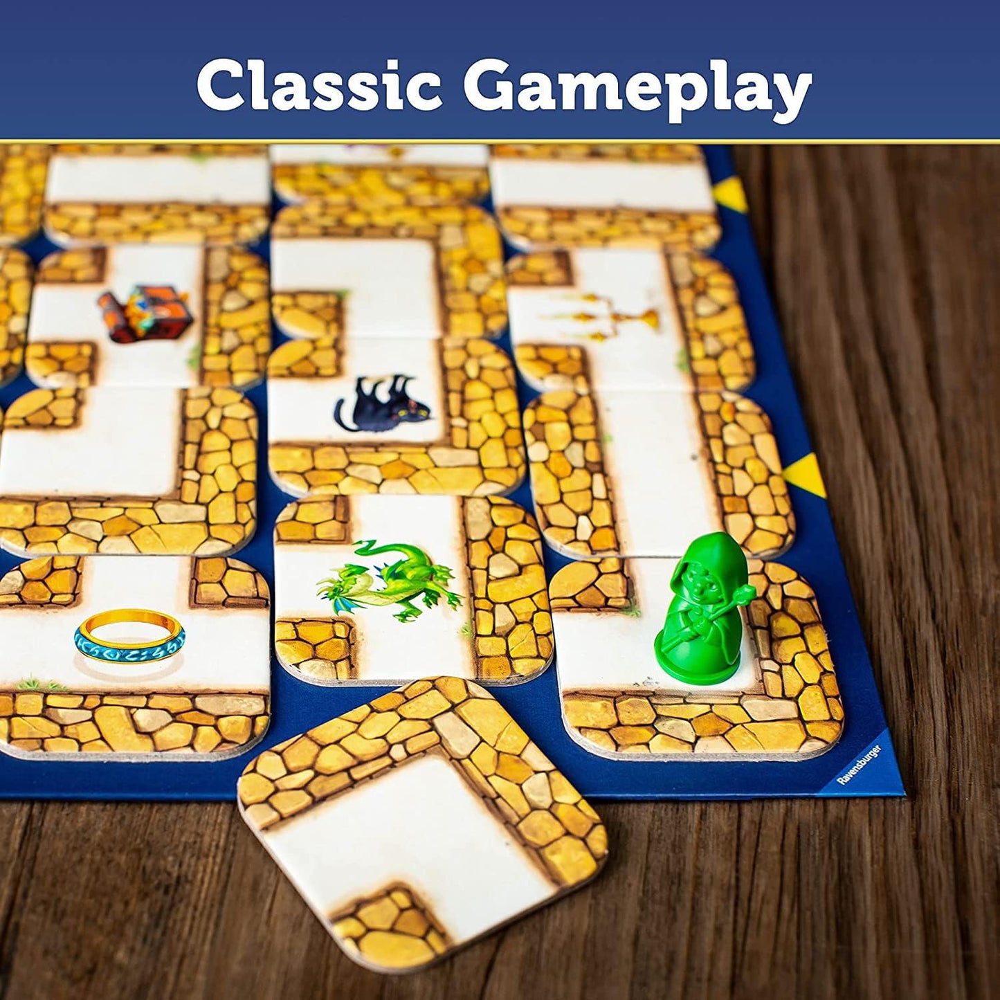 Board game with tiles featuring stone patterns and small figures on a wooden surface