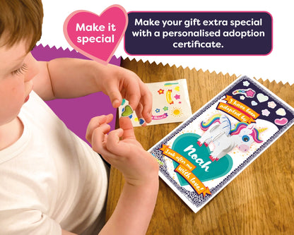 Child holding a personalized adoption certificate with a unicorn design on a wooden surface.