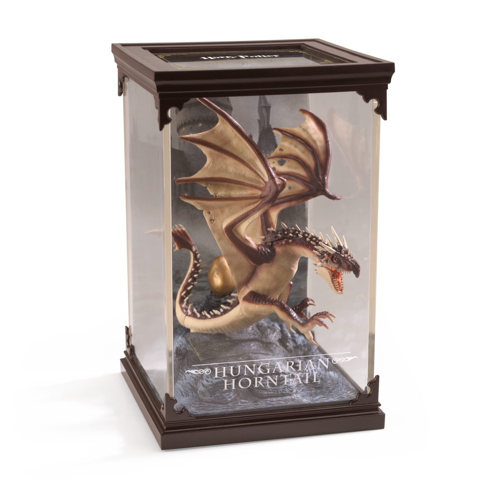 Model of a Hungarian Horntail dragon in a display case with 'Harry Potter' branding.