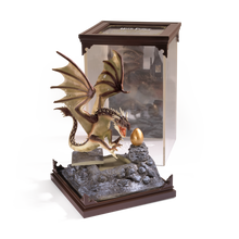 Hungarian Horntail Dragon figurine with a golden egg in a display case, featuring 'Harry Potter' branding.