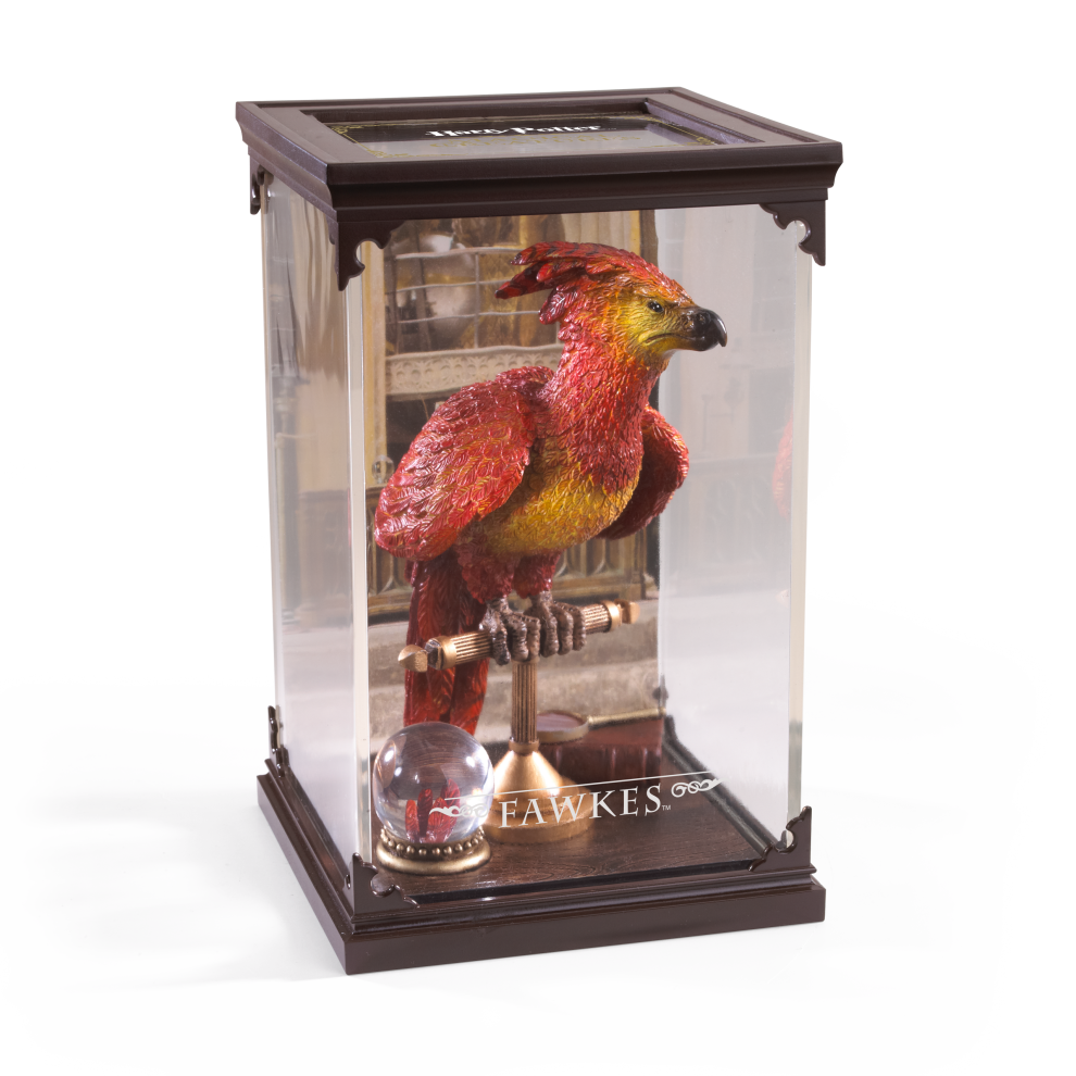 Model of a phoenix bird in a glass display case with 'Harry Potter' branding.