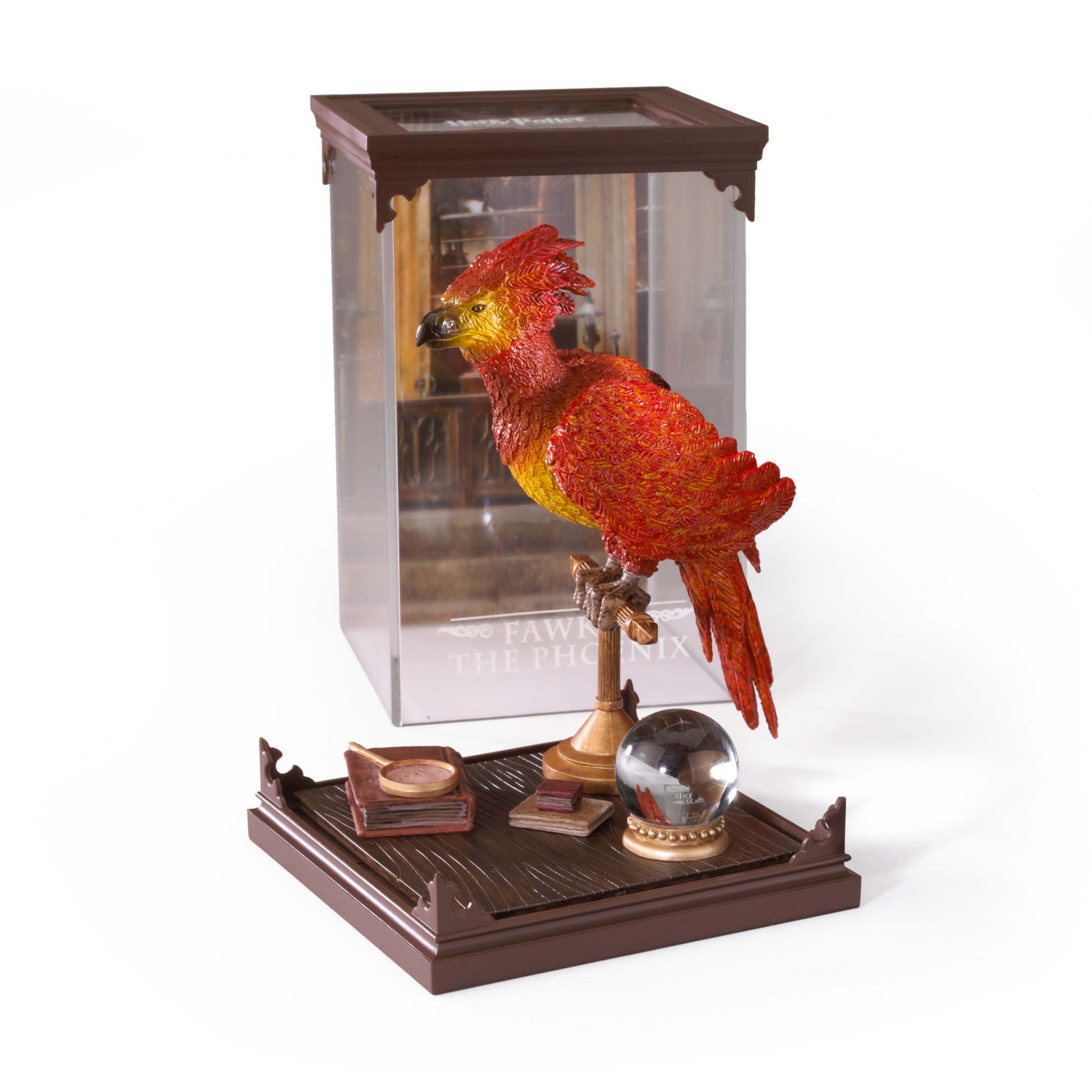 Decorative Fawkes figurine in a plastic case on a wood effect base with a white background