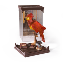 Decorative Fawkes figurine in a plastic case on a wood effect base with a white background