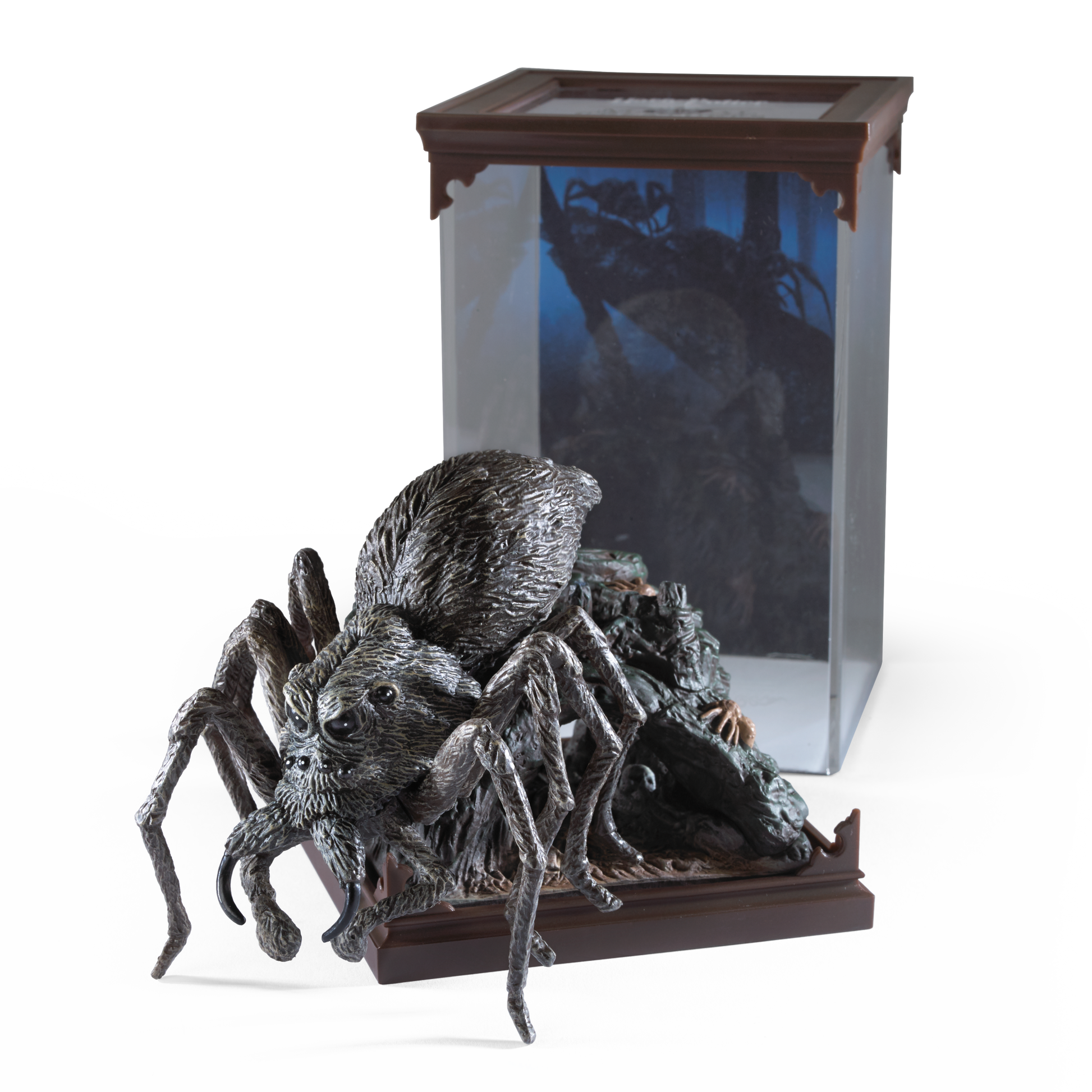 Detailed Aragog figurine in front of a glass display case with a dark interior.