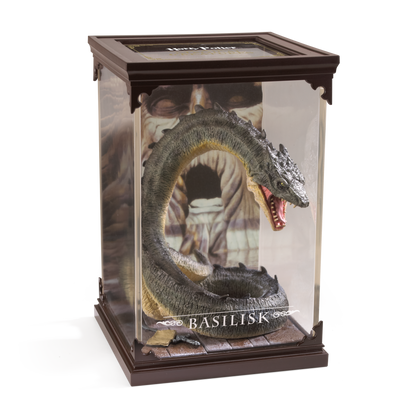Model of a basilisk in a glass display case with 'Harry Potter' branding.
