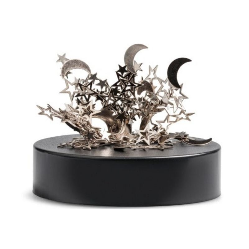 Decorative metal sculpture with stars and moons on a black base