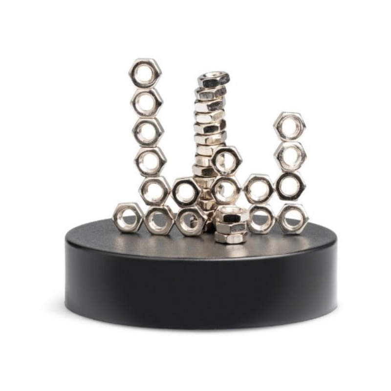 Metallic hex nuts arranged on a black base against a white background