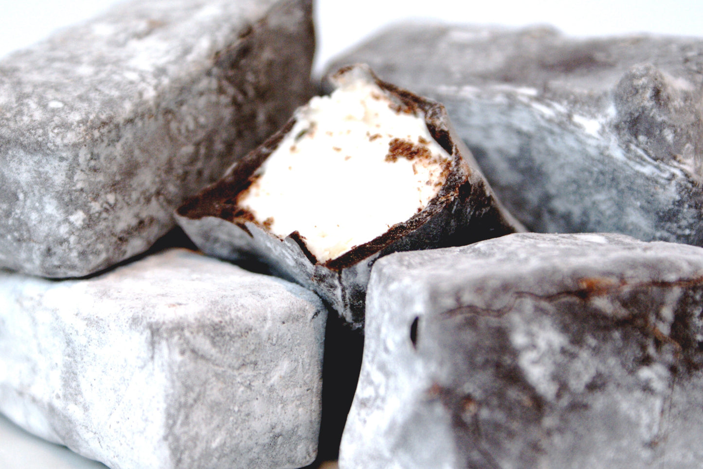 Close-up of chocolate truffles with a white background