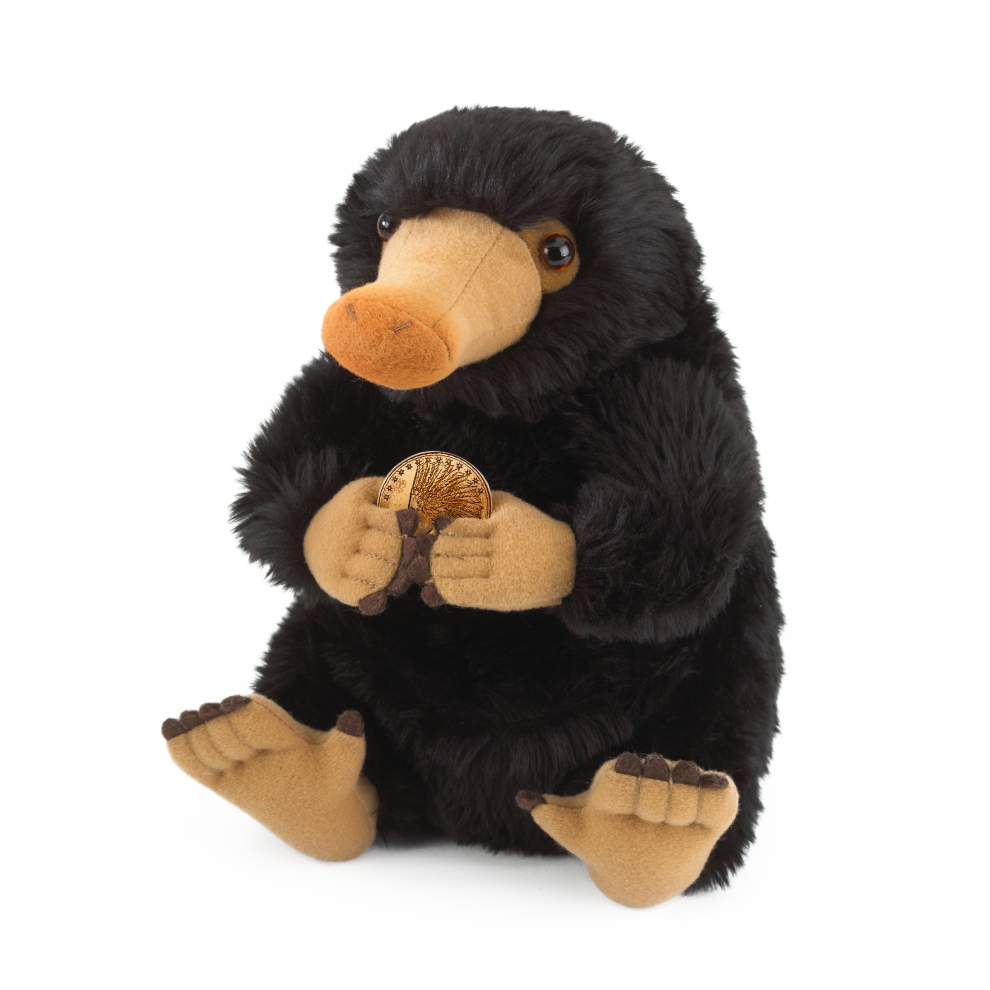 Plush toy resembling a Niffler holding a gold coin on a white background