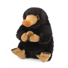 Plush toy resembling a Niffler holding a gold coin on a white background