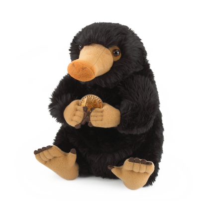 Plush toy resembling a Niffler holding a gold coin on a white background